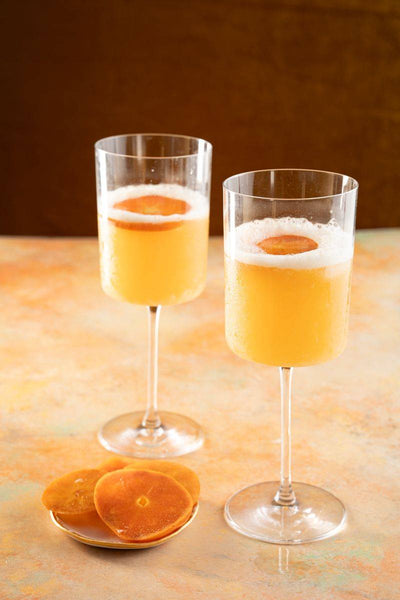 Amaretto sours with orange slices.