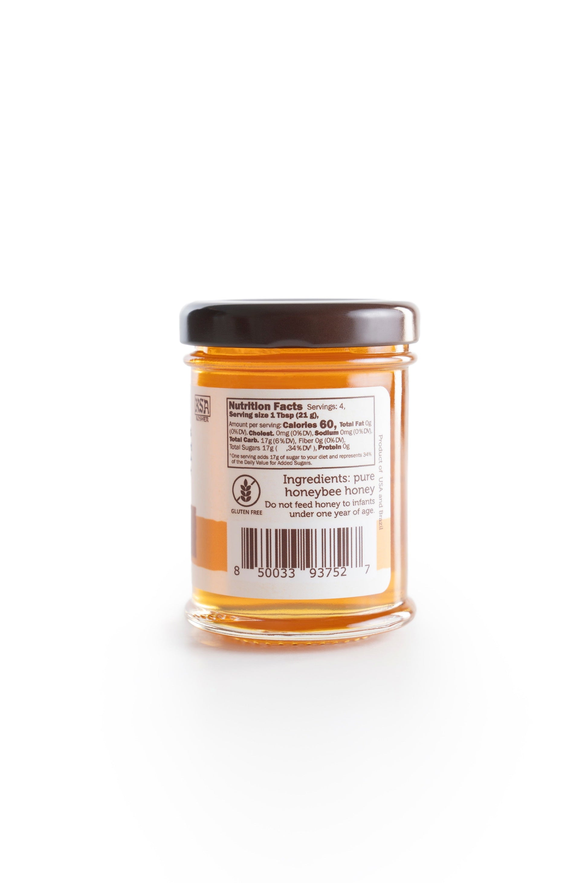 3 ounce Honey for coffee in a glass jar back view on a white background