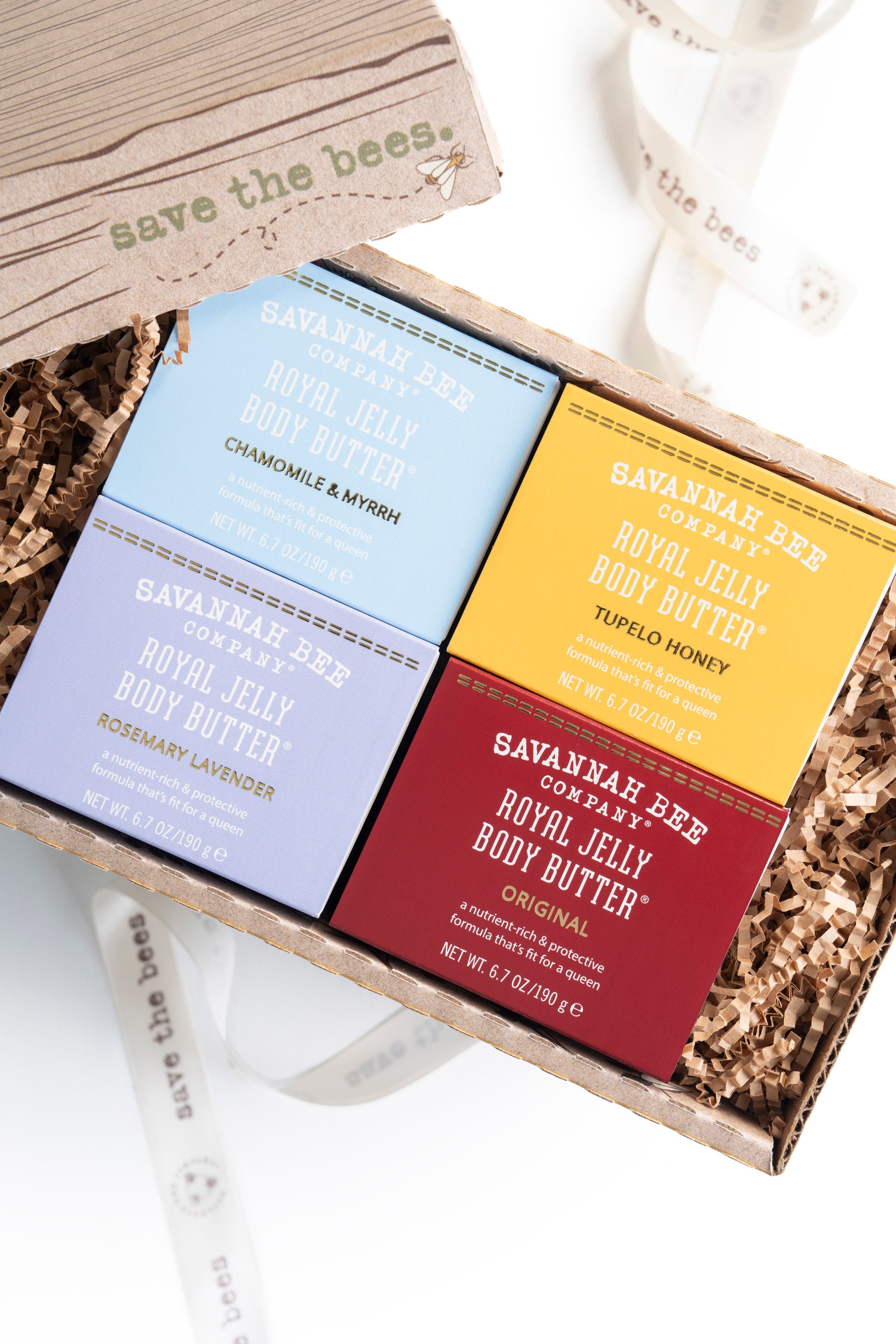 Chamomile and Myrrh Royal Jelly Body Butter, Tupelo Royal Jelly Body Butter, Rosemary Lavender Royal Jelly Body Butter, and Original Royal Jelly Body Butter in a gift box