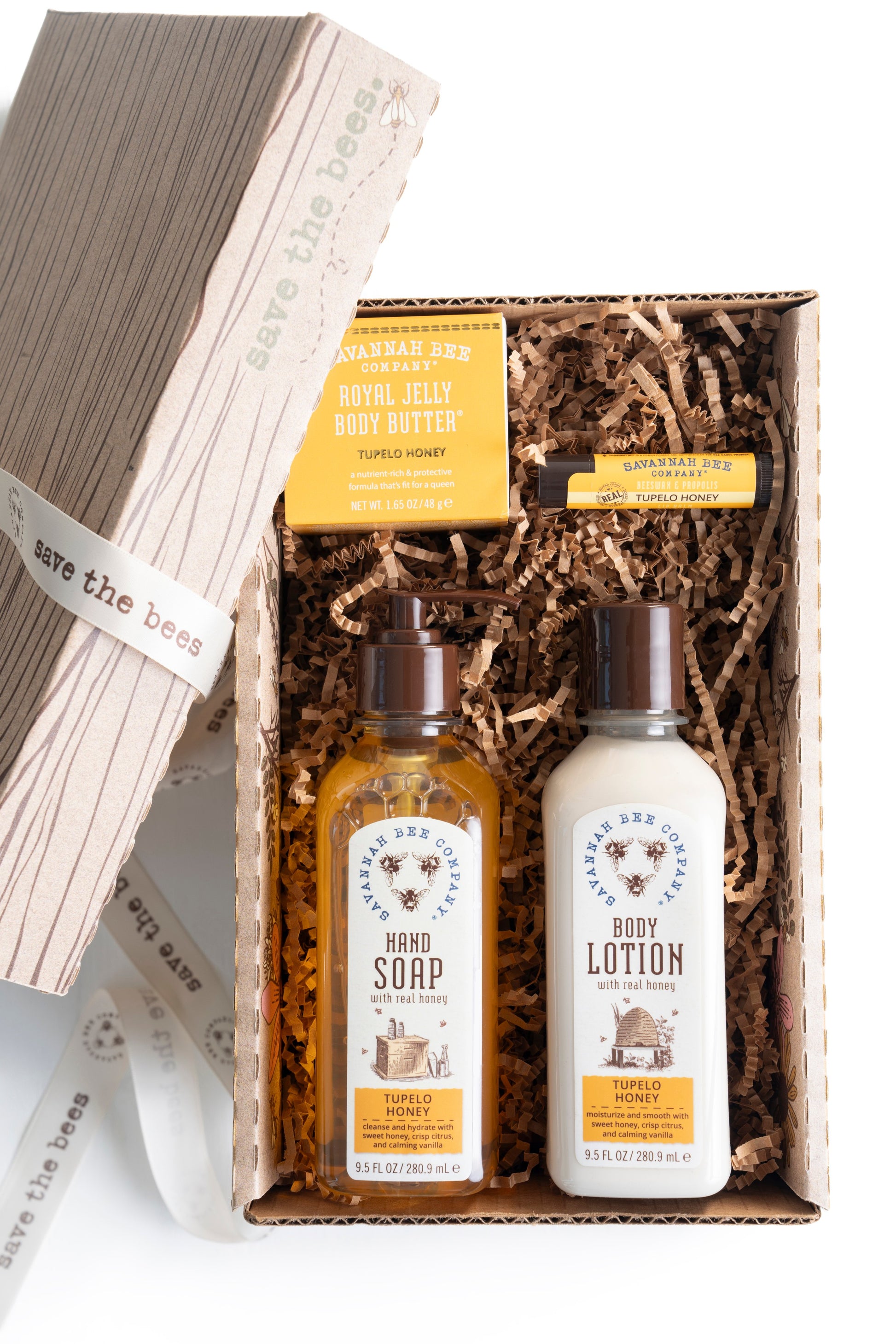 Tupelo Honey Hand Soap, Tupelo Honey Body Lotion, Tupelo Honey Royal Jelly Body Butter, and Tupelo Lip Balm in a Save The Bees gift box.