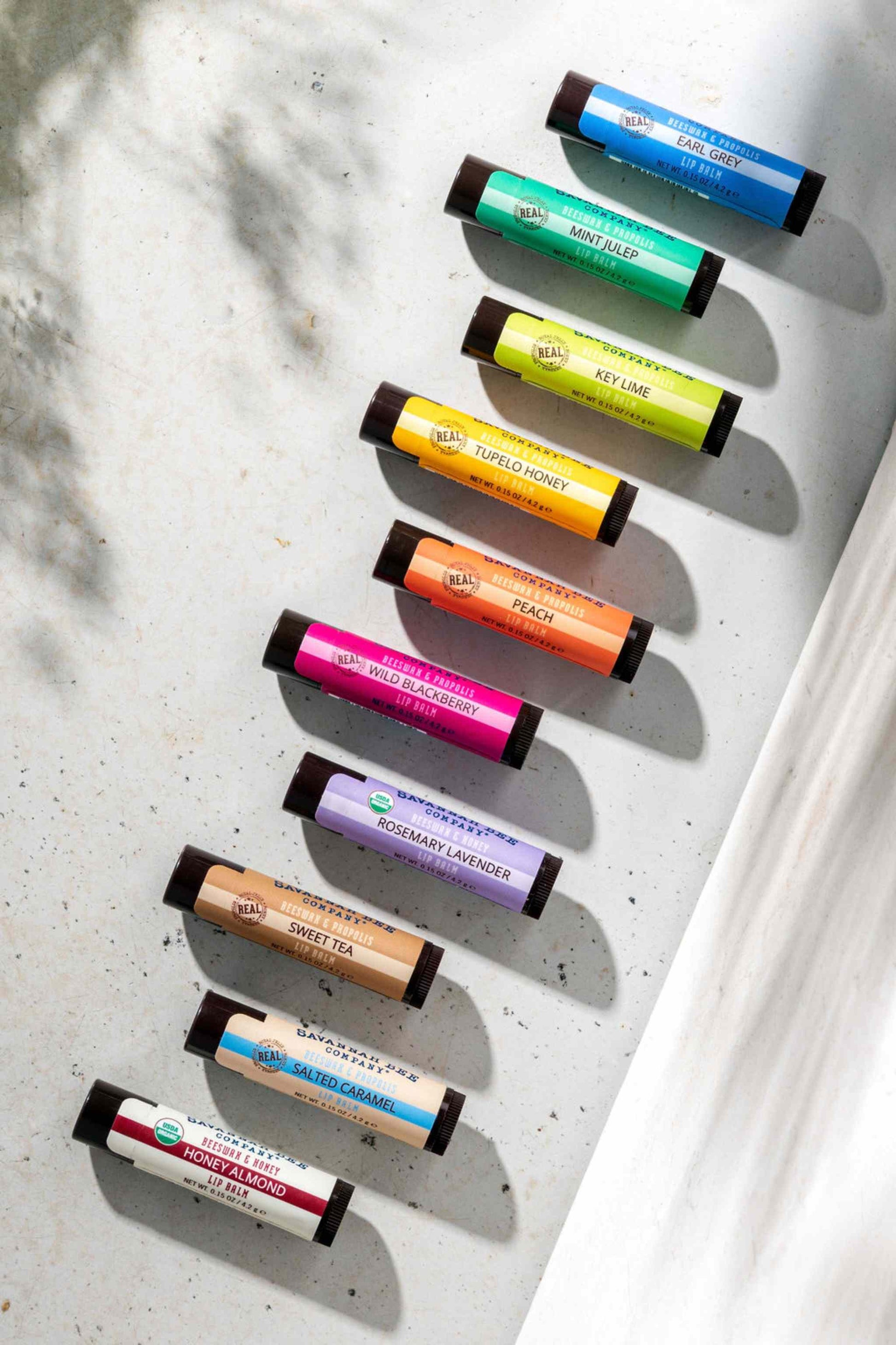 Earl Grey, Mint Julep, Key Lime, Tupelo Honey, Peach, Wild Blackberry, Rosemary Lavender, Sweet Tea, Salted Caramel and Honey Almond Savannah Bee Lip Balm Assortment